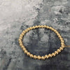 14 Karat goldplattiertes Armband aus filigranen Perlen
