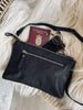 Clutch in schwarzem Leder
