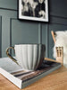 Teetasse mit Goldhenkel – Beige