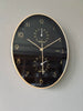 Wanduhr in Schwarz und Gold